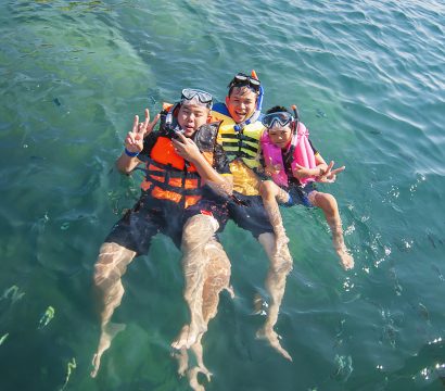 Three guys floating happily in the sea water